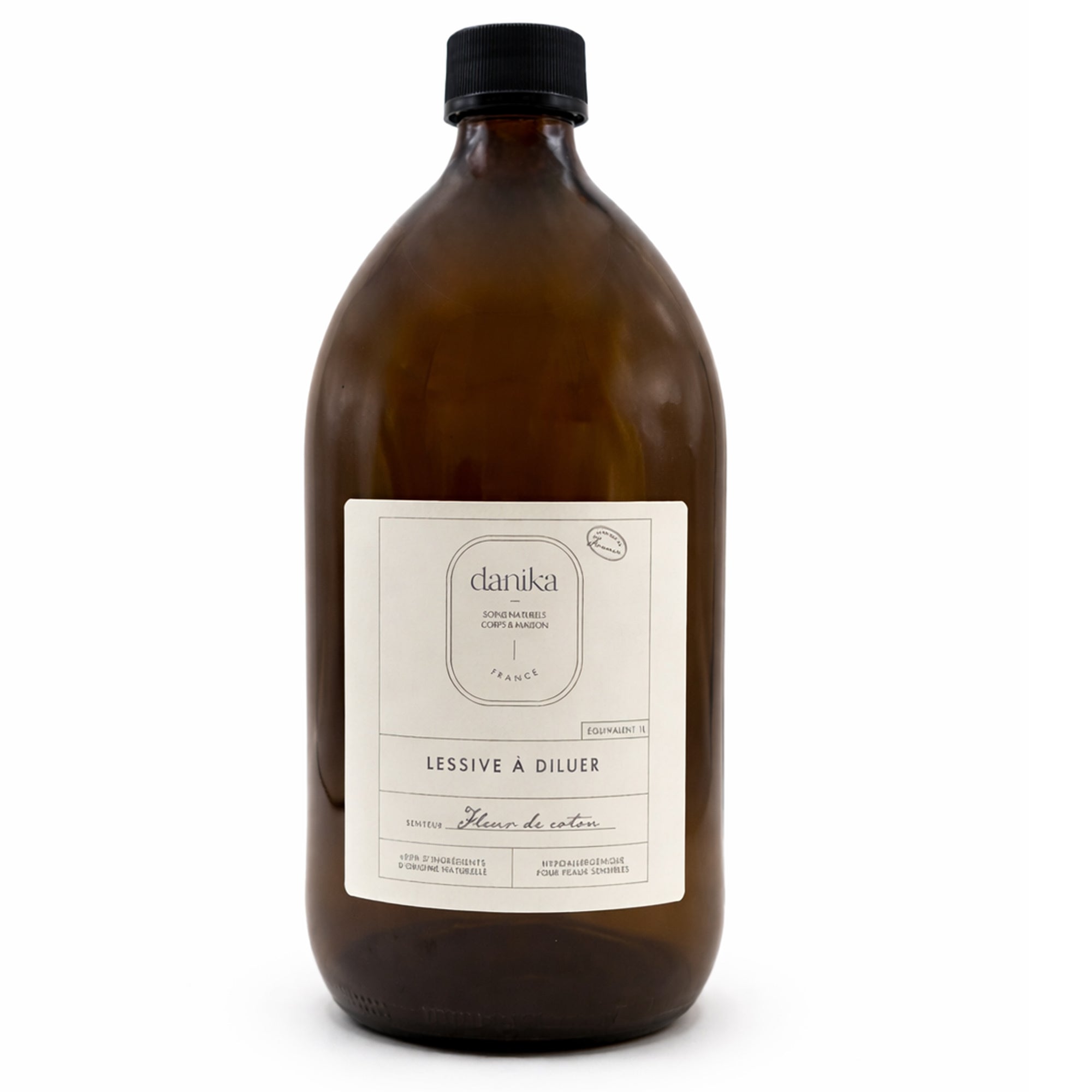 Un flacon en verre pour la lessive fleur de coton